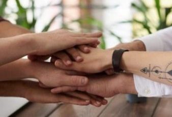 photo-of-people-near-wooden-table-3184431